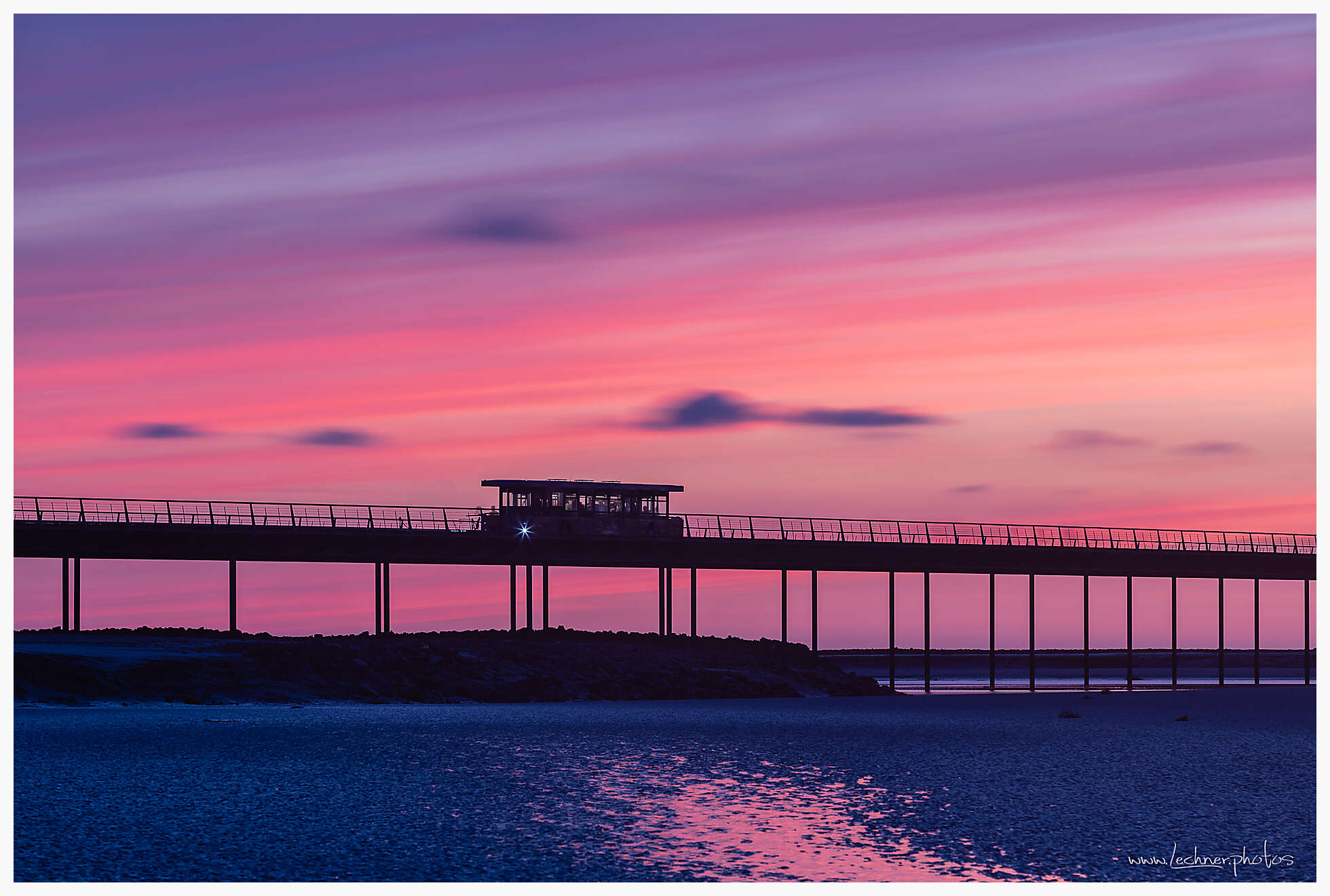 Sunset bridgte to Mont Saint Michel with a bus